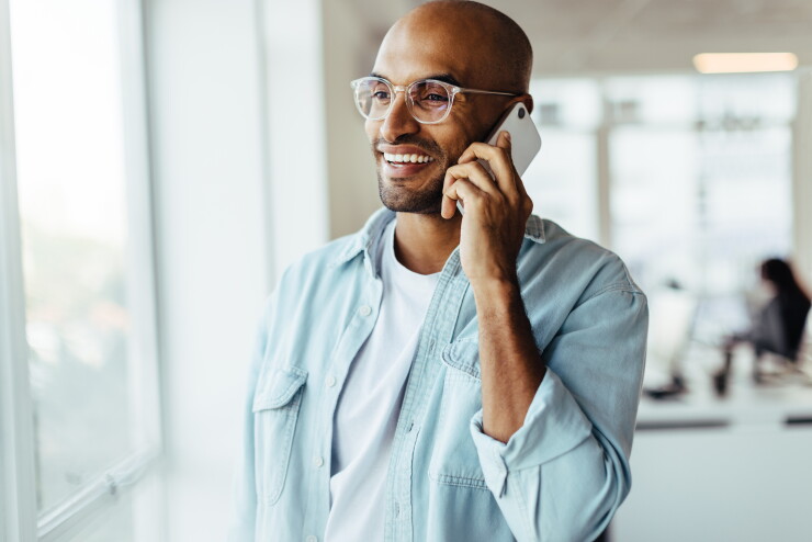 Man talking on phone, smiling