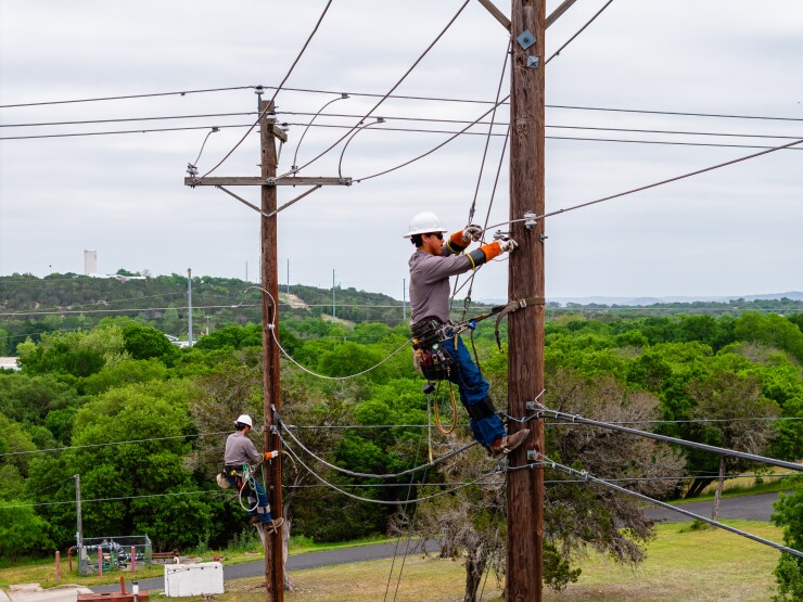 Kerrville Public Utility Board linemen working in the Texas Hill Country