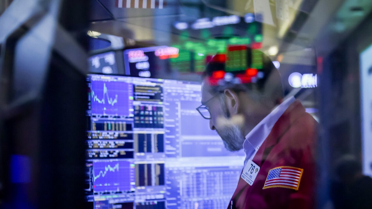 Traders At The New York Stock Exchange