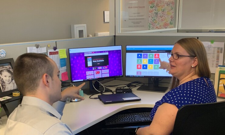 Members of Partners Federal Credit Union’s “Talent Strategies” team discuss concierge services available for the CU's staff.