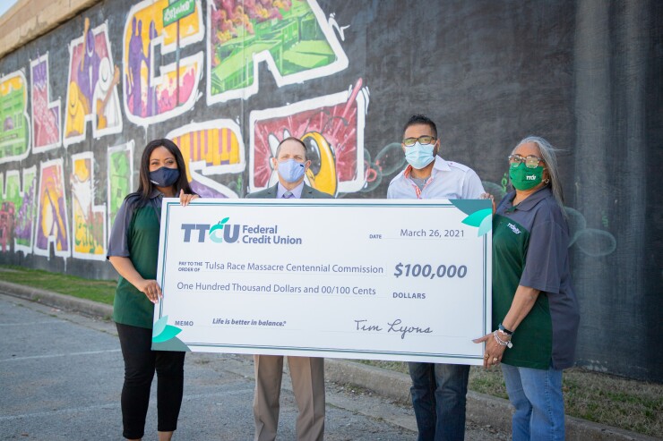 TTCU representatives pictured during a check presentation to the the Tulsa Race Massacre Centennial Commission