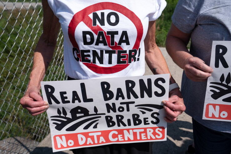 A protest at the site of a data center under construction in Saline Township, Michigan