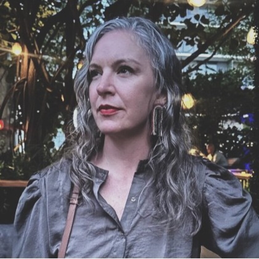 A woman posing for a photo.