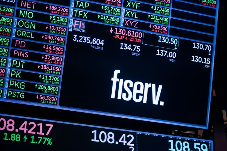Fiserv logo displayed on signage on the floor of the New York Stock Exchange.
