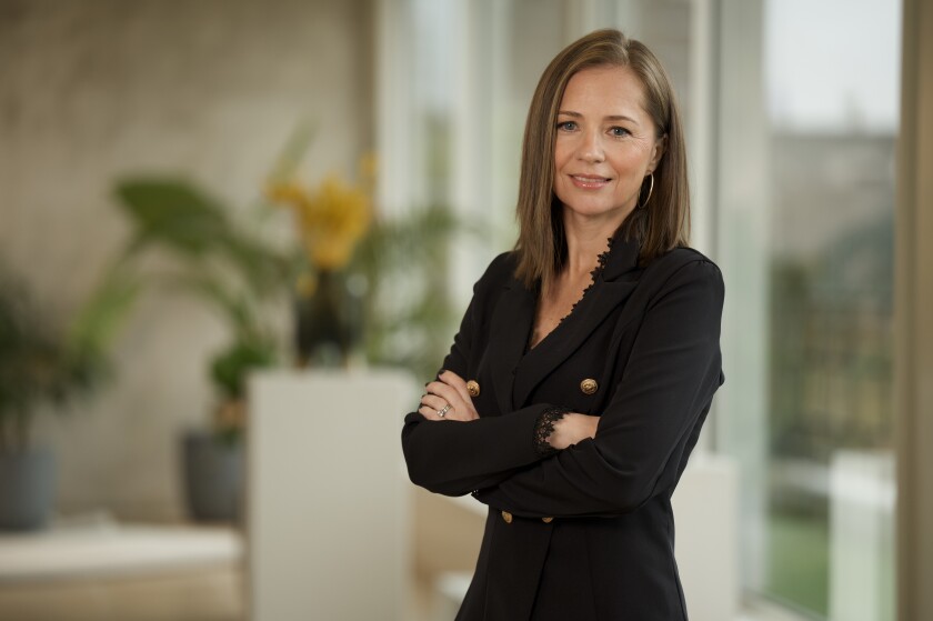 Headshot of Olga Collins, CEO of Worldwide Broker Network.