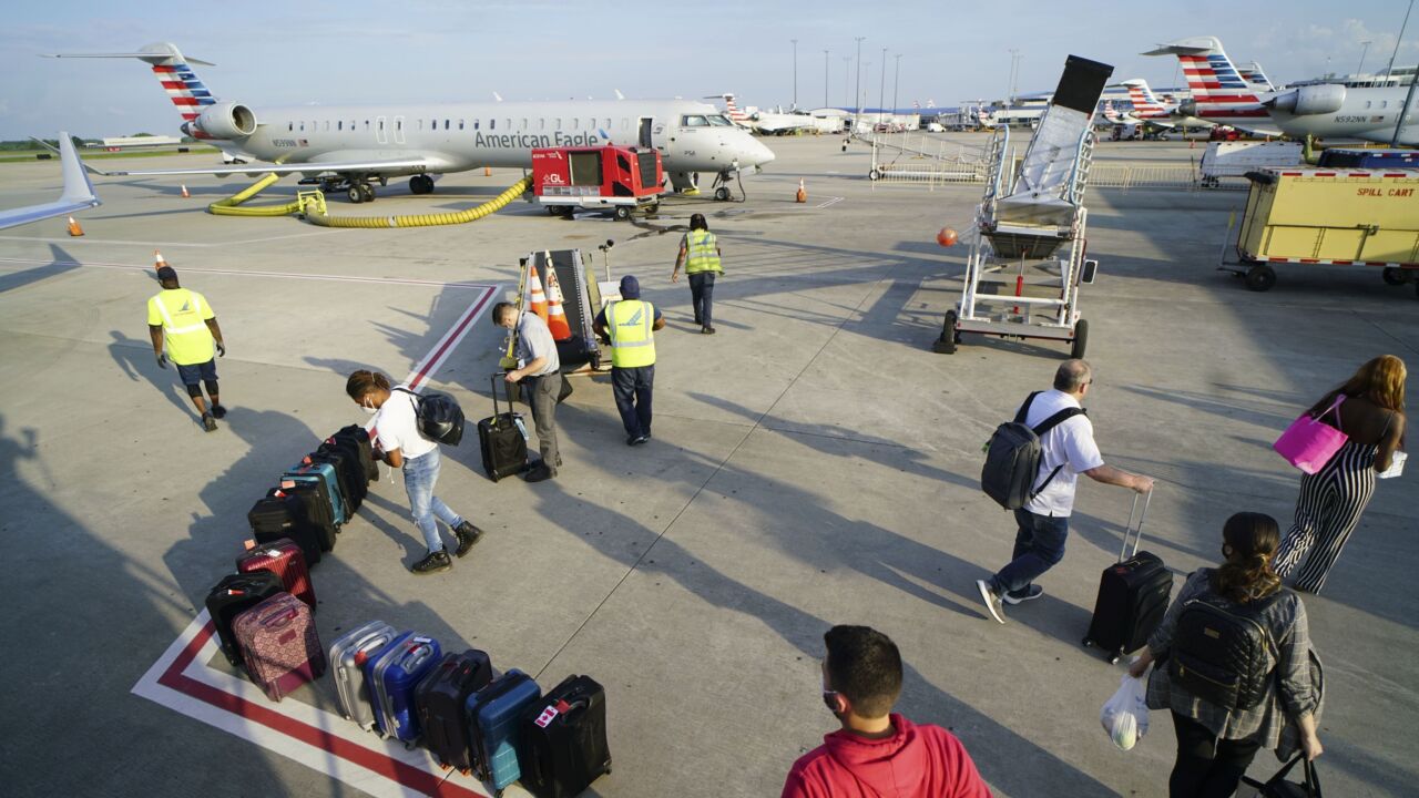 Passengers and a regional jet at Charlotte Douglas International Airport