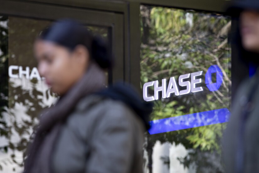 A pedestrian walks past a JPMorgan Chase bank branch in Chicago on Oct. 12, 2019.