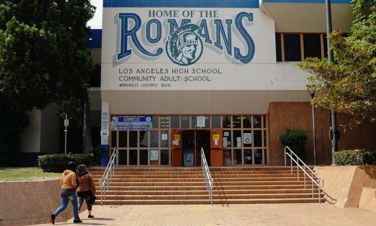 A parent and child enter Los Angeles High School