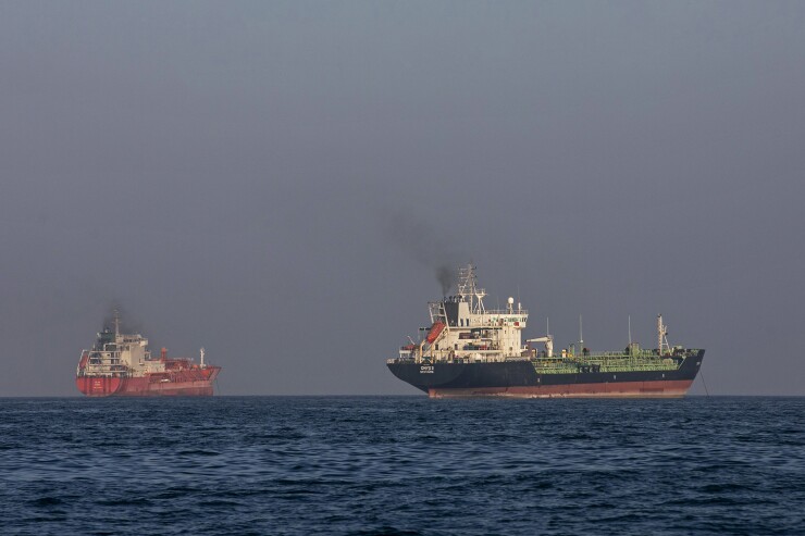 Ships remain anchored in the Strait of Hormuz near Larak Island, Iran, on May 16, 2026.