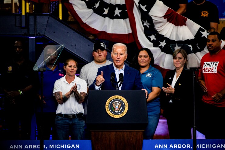 President Biden at a podium, speaking.