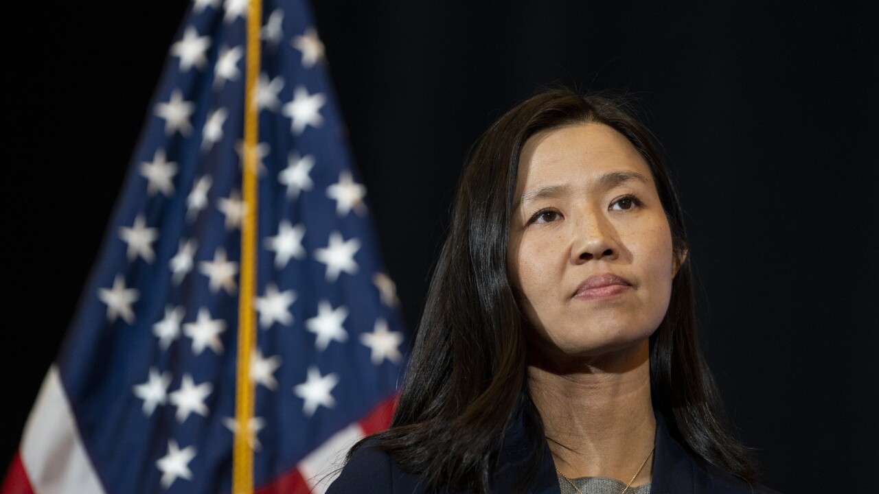 Michelle Wu with flag in background