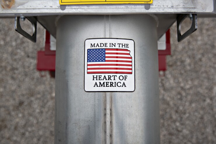 A "Made In The Heart Of America" sticker is displayed on grain loading equipment on display during the Farm Progress Show in Boone, Iowa.