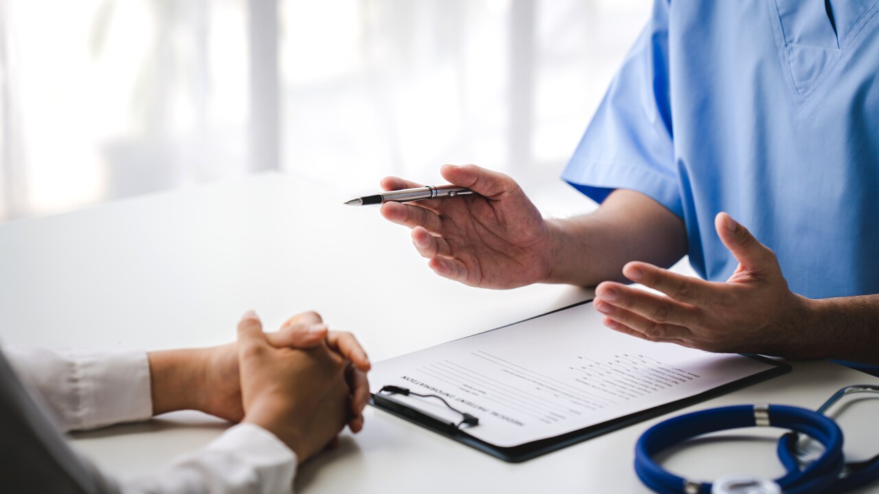 Doctor explaining something to a patient