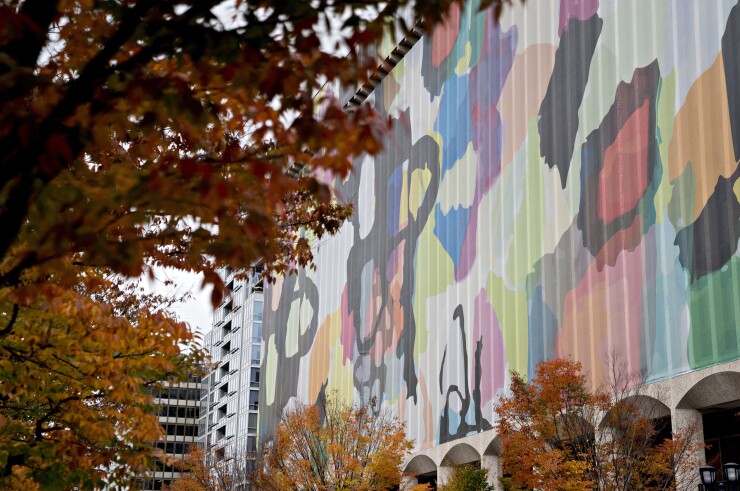 A tarp drapes the 1851 S. Bell Street building in the Crystal City area of Arlington, Virginia, U.S., on Tuesday, Nov. 13, 2018. Amazon.com Inc. will build new offices in New York City and Arlington.