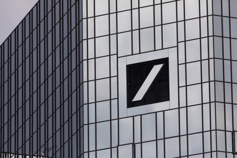 The Deutsche Bank logo sits on the bank's headquarters in Frankfurt, Germany.