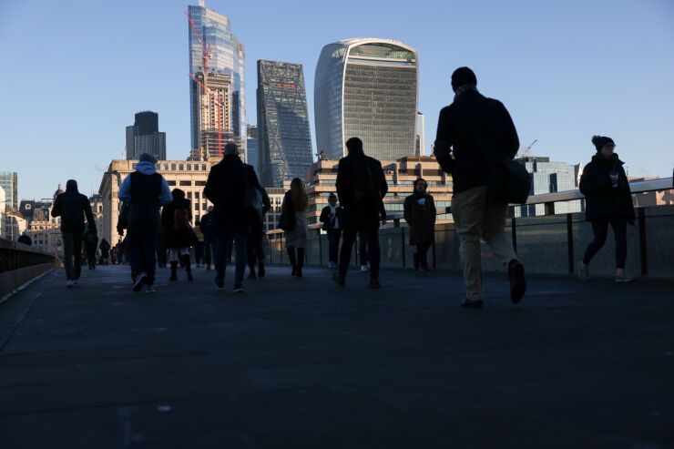 Commuters As U.K. Jobs Market Shrugs Off Omicron