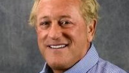 A man smiling for a photo.