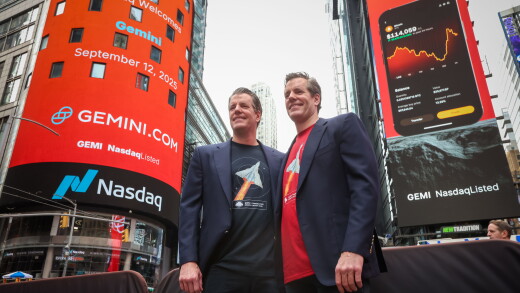 A picture of Tyler and Cameron Winklevoss outside Nasdaq.