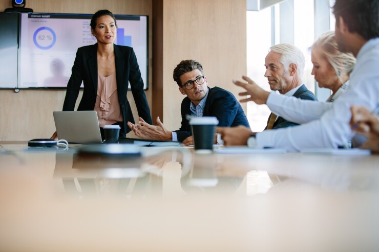 People meet in a boardroom