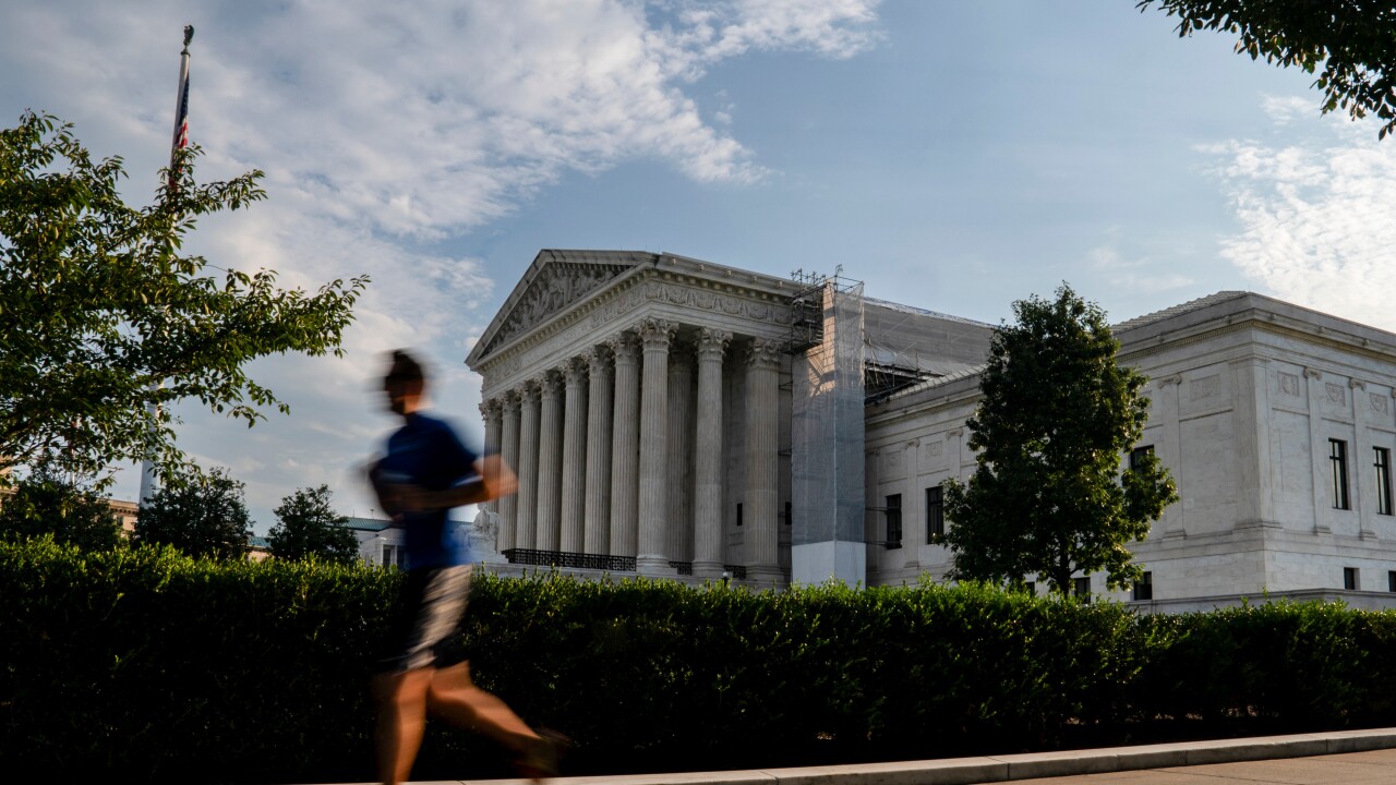 A person jogs outside the Supreme Court building in Washington, D.C.