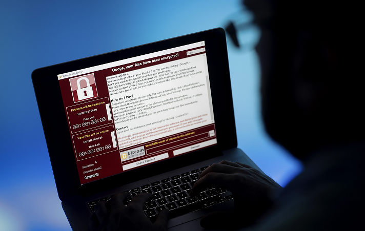 Screen showing laptop that has been hacked