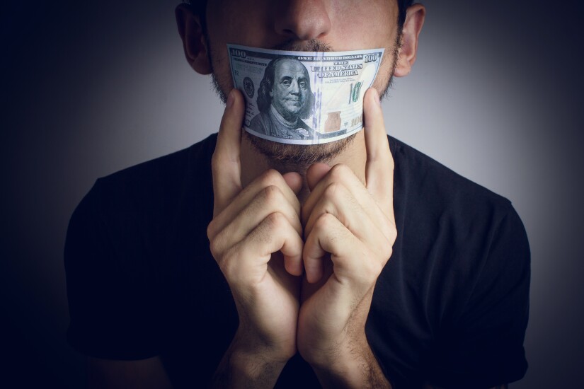 Money in front of mouth