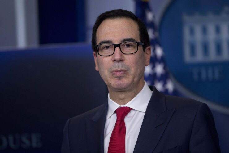 Steven Mnuchin, U.S. Treasury secretary, listens to a question during a White House press briefing in Washington.