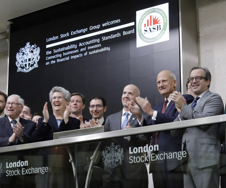 SASB Chair Jeffrey Hales (center) at the opening bell of the London Stock Exchange