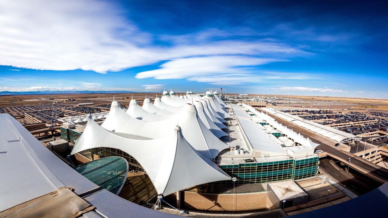 A view of Denver International Airport's Jeppesen Terminal with the airfield in the background.