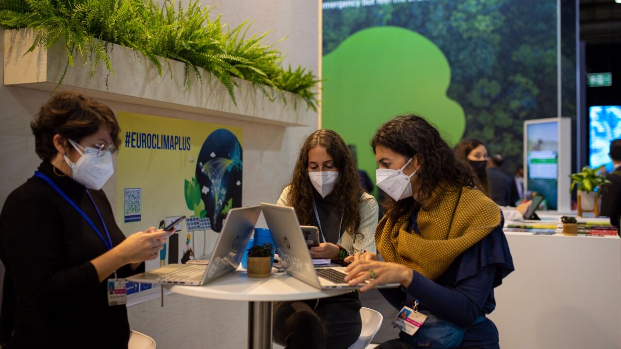 Attendees work from laptops during the COP26 climate talks in Glasgow, U.K., on Wednesday, Nov. 3, 2021. Climate negotiators at the COP26 summit were banking on the world’s most powerful leaders to give them a boost before they embark on two weeks of fraught discussions over who should do what to slow the rise in global temperatures. Photographer: Emily Macinnes/Bloomberg