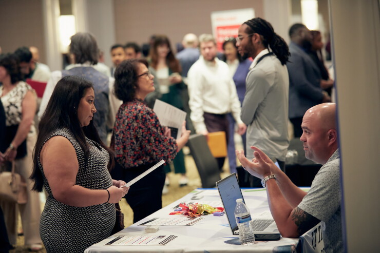 A picture of job hunters at a jobs fair.