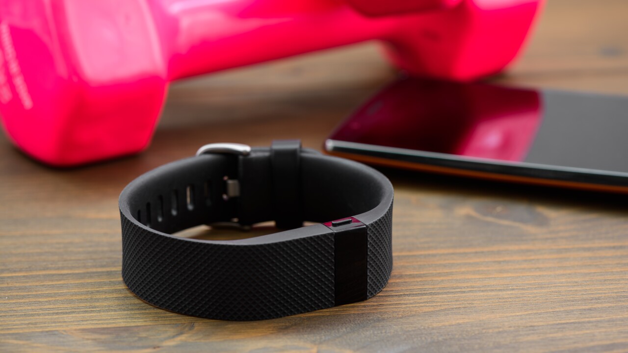 A fitness tracker and smartphone