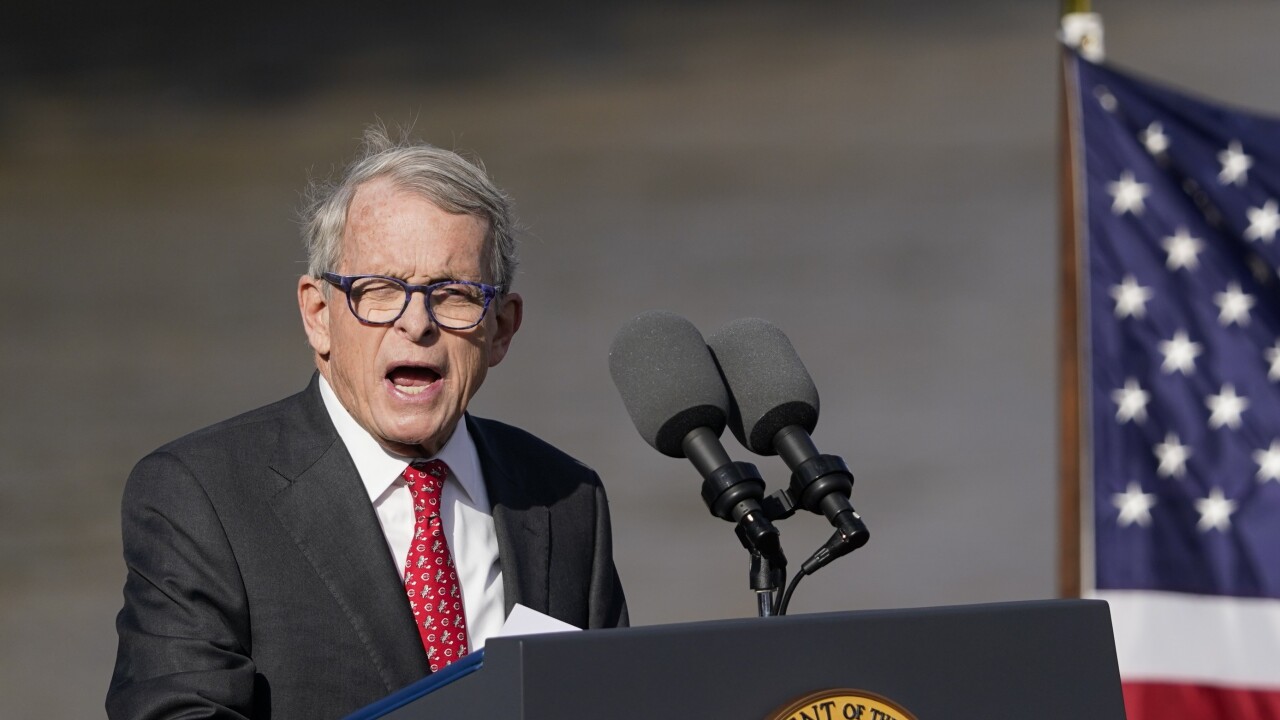 Ohio Gov. Mike DeWine speaks at lectern
